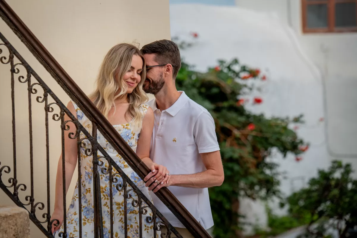 Couple posing on a picturesque staircase in Naxos, captured by a Naxos photographer