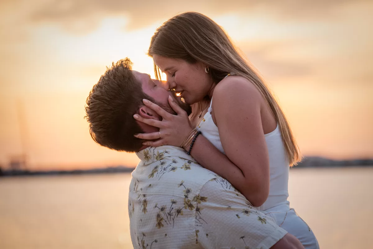couple kissing with a beautiful sunset background in naxos, by naxos photographer