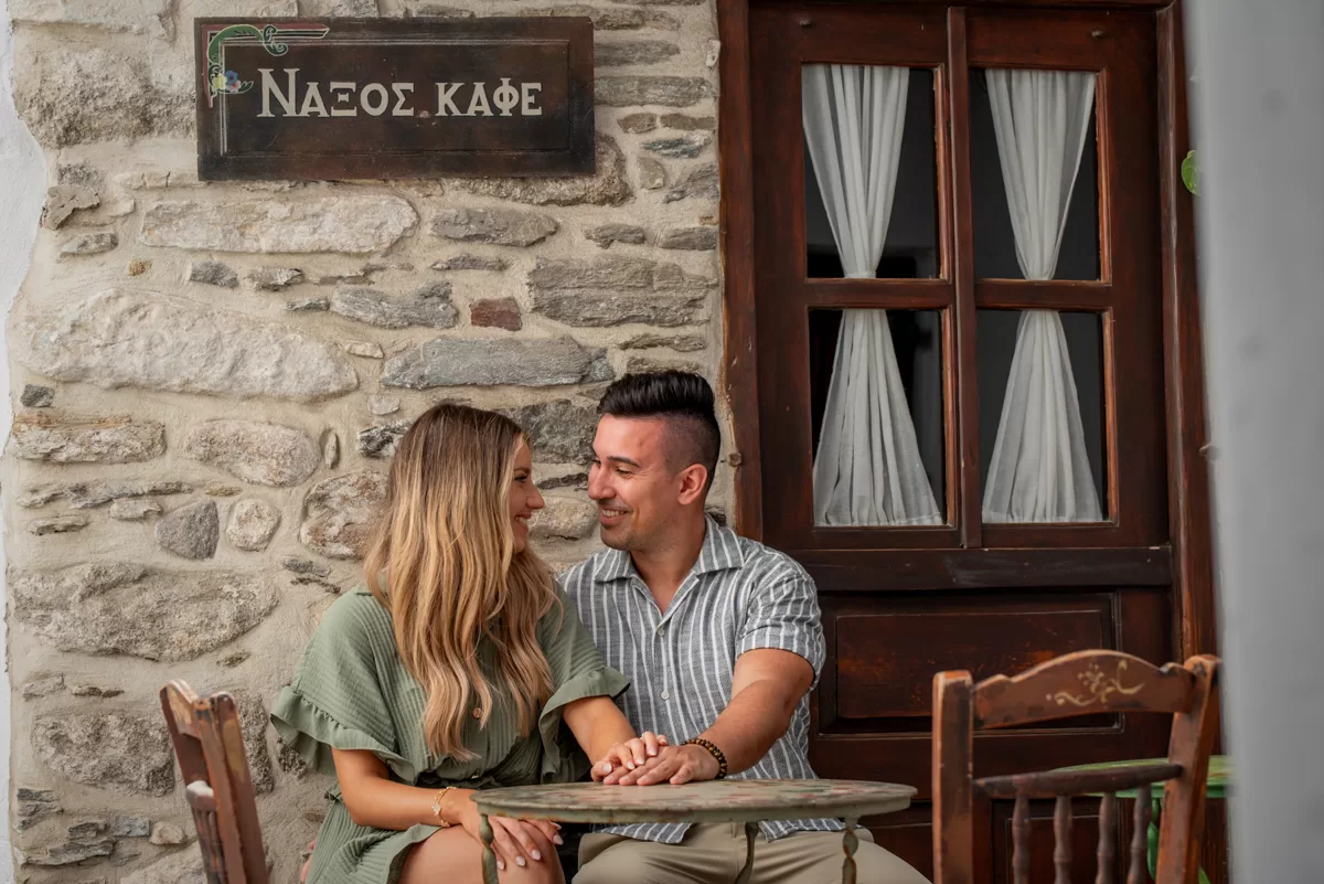 Couple sitting at a coffee shop in naxos old town, by naxos photographer