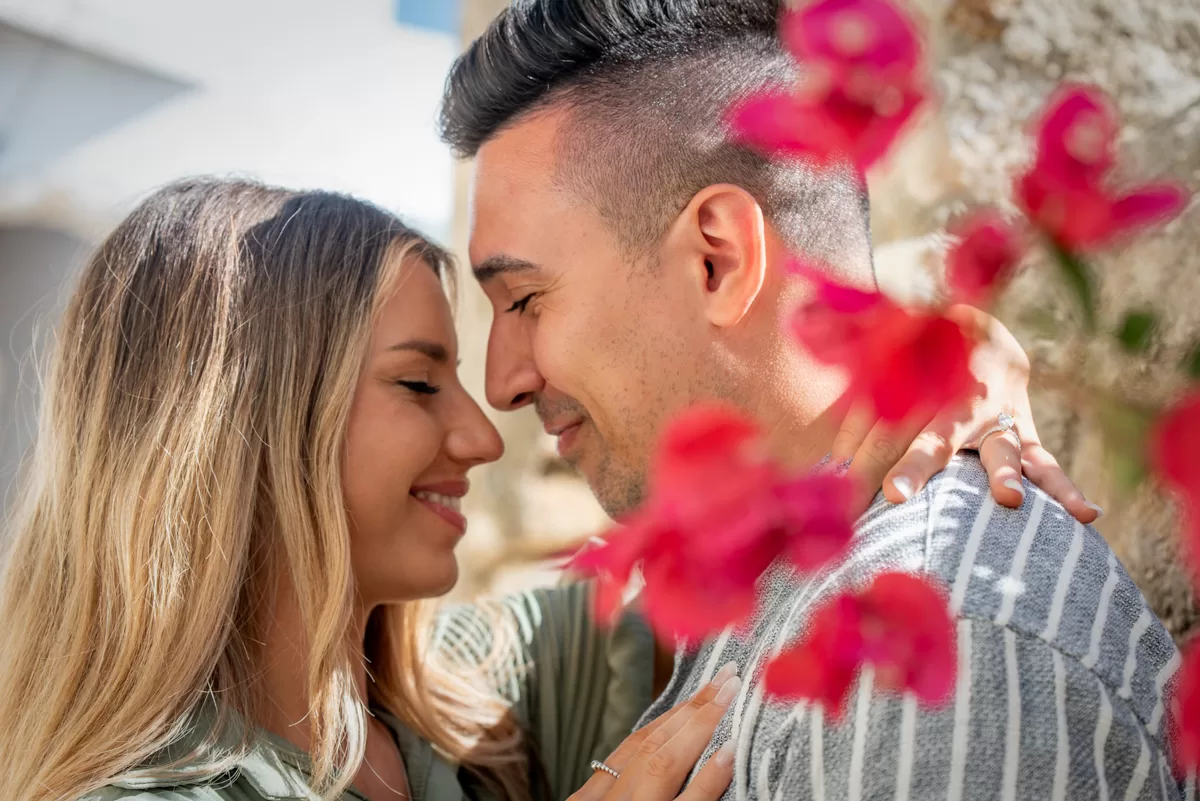 close shot of a couple smiling at each other, we can also see the engagement ring, by naxos photographer