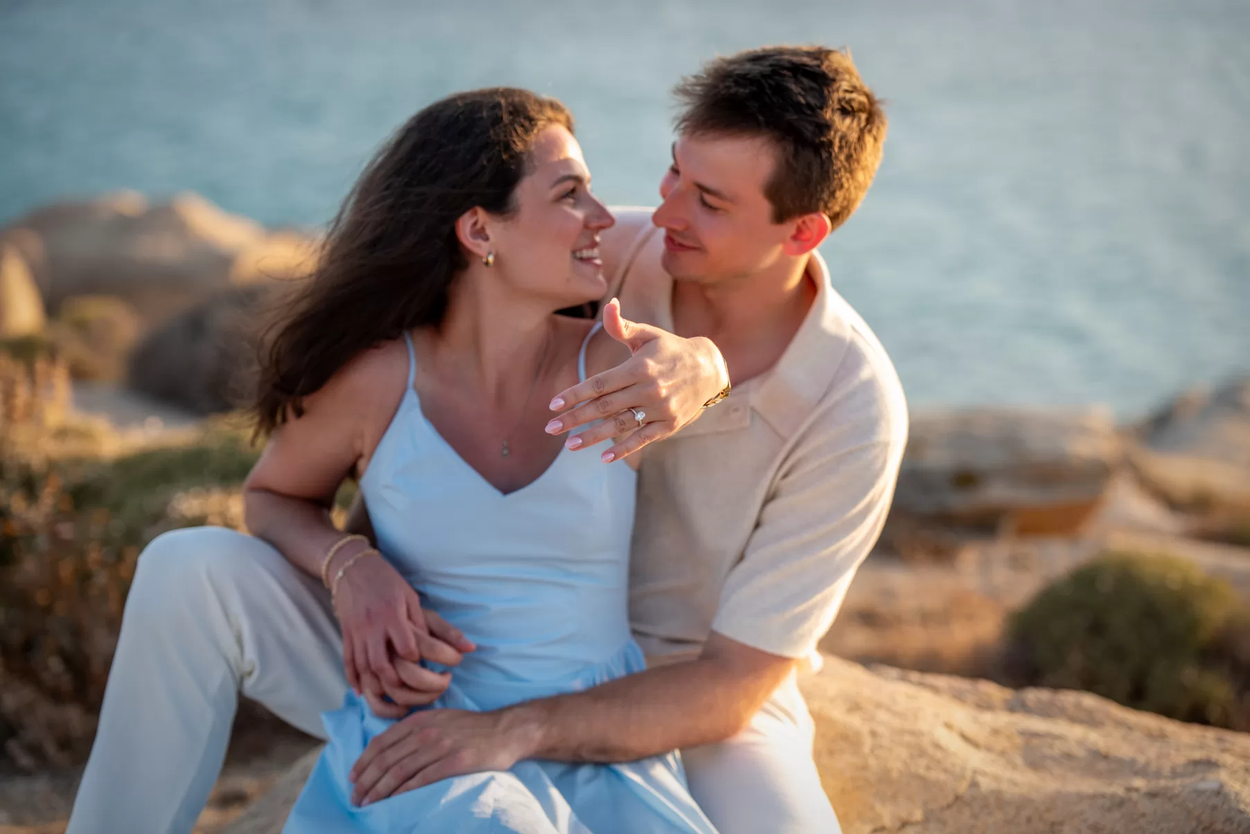Couple posing after engagement, while the girl shows her ring, captured by Naxos Photographer